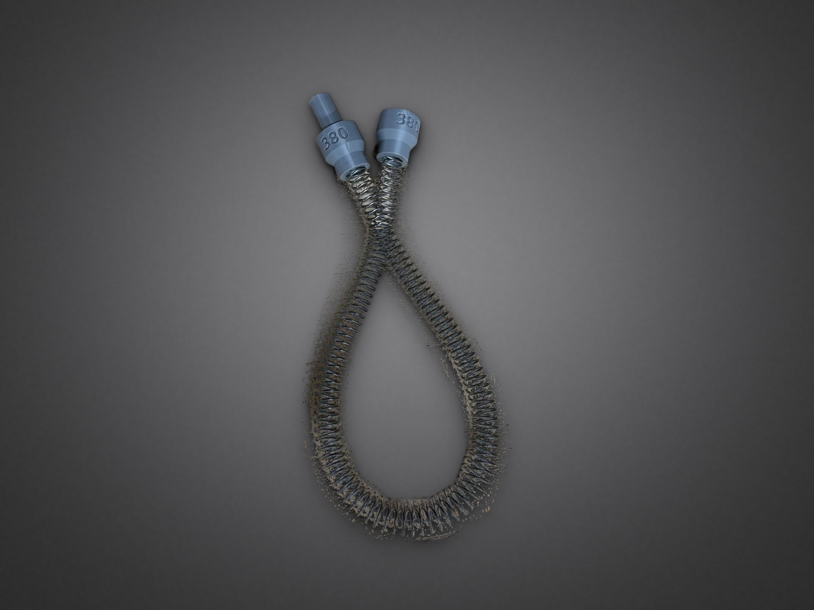 .380 Feed Spring Assembly — feed spring with two gray 380-marked end fittings
